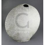 § James Tower (1919-1988). A large stoneware disc shaped vase, c.1983, the white tin-glaze with