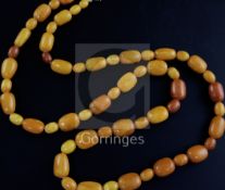 A single strand oval amber bead necklace, with gilt metal clasp, gross weight 104 grams, 104cm.