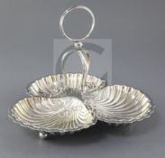 A late Victorian silver trefoil shaped hors d'oeuvres dish by Josiah Williams & Co, with engraved