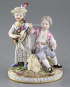 A Meissen group of a young couple, late 19th century, the lady playing a mandolin and the young