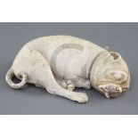 An early 19th century Dieppe carved ivory model of a sleeping Pug dog, various collector's labels