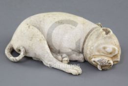 An early 19th century Dieppe carved ivory model of a sleeping Pug dog, various collector's labels