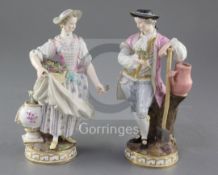 A pair of Meissen porcelain figures of gardeners, late 19th century, underglaze blue crossed