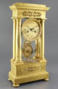 A second quarter of the 19th century French ormolu portico clock, of characteristic form, with 4