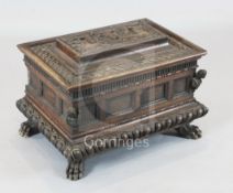 A 17th century Italian walnut casket, the top inset with a plaque depicting an urn and cherubs