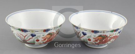 A pair of Chinese wucai 'dragon and phoenix' bowls, Qianlong mark and of the period (1736-95),