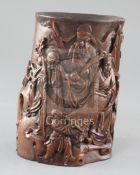 A Chinese hardwood brushpot, carved in high relief with the three star gods and an attendant, one