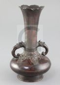 A Chinese bronze bottle vase, Song - Yuan dynasty, the petal rimmed trumpet shaped neck applied with