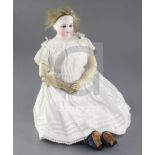 A French bisque shoulder head doll, possibly Eugene Barrois, c.1860, with fixed blue cane glass