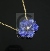 A 9ct gold, lapis lazuli and diamond set flower pendant, on a 9ct gold chain, pendant 24mm.