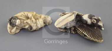 Two Japanese ivory netsuke, 19th century, the first carved as a child suckling its mother's