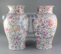 A pair of Chinese 'thousand flower' baluster vases, Republic period, each modelled with a pair of