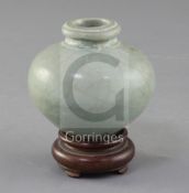 A Chinese Longquan celadon ovoid jar, Song - Yuan dynasty, 7.5cm, wood stand