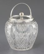 An Edwardian silver mounted cut glass biscuit barrel and cover, by John Grinsell & Sons, London,