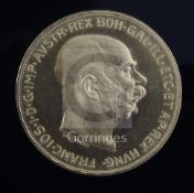 An Austrian 100 Corona gold coin, 1915 proof restrike, Franz Joseph I bare head obverse, Arms of