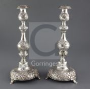 A pair of late Victorian repousse silver Sabbath day candlesticks by Moses Salkind, with waisted