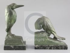 After Van de Voorde. A pair of patinated spelter bookends, modelled as a parrot and a heron, each