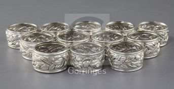 A set of twelve Tiffany & Co sterling silver napkin rings, with embossed decoration, diameter