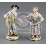 Two Meissen figures of gardeners, late 19th century, the gentleman holding a pole handle, the lady