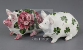 Two Wemyss models of pigs, early 20th century, the first decorated with cabbage roses, inscribed