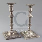 A pair of late George II cast silver candlesticks by Thomas Whipham and Charles Wright, with