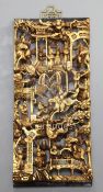 A Chinese carved giltwood panel depicting Courtesans and Warriors, H.54cm x W.24.5cm