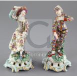 A pair of Bow porcelain figures of Harlequin and Columbine, c.1770, each wearing multi-coloured