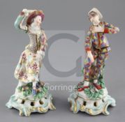 A pair of Bow porcelain figures of Harlequin and Columbine, c.1770, each wearing multi-coloured