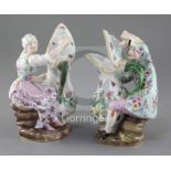 A pair of Meissen figural ewers, 19th century, modelled as a lady and a gentleman holding a flower