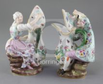 A pair of Meissen figural ewers, 19th century, modelled as a lady and a gentleman holding a flower