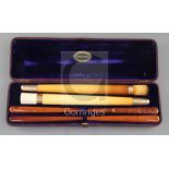 An Edwardian F. Edwards & Co of Glasshouse Street leather cased set of two gold banded meerschaum