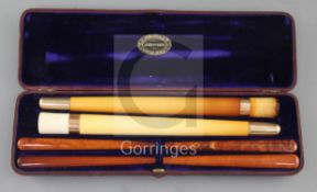 An Edwardian F. Edwards & Co of Glasshouse Street leather cased set of two gold banded meerschaum