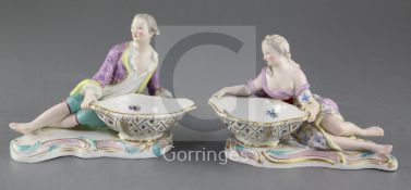 A pair of Meissen figural salts, late 19th century, modelled as a recumbent lady and gentleman