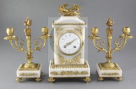 An early 20th century French marble clock garniture, the case and candlesticks with applied ormolu