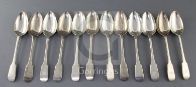 A set of twelve George V silver fiddle pattern table spoons, C.W Fletcher & Sons Ltd, with