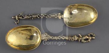 Two 18th/19th? century silver gilt apostle spoons, with spiral stems and rat tail bowls,