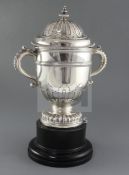 A George VI silver two handled trophy cup and cover by William Comyns & Sons Ltd, with card cut