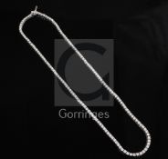 A modern 14ct white gold and diamond tennis necklace, set with one hundred and forty seven round