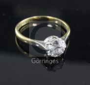 A 1980's 18ct gold and solitaire diamond ring, the round cut stone weighing approximately 1.25cts,