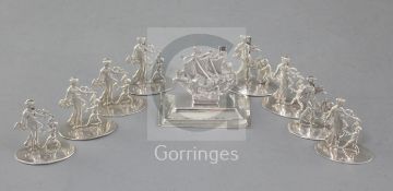 A set of eight Edwardian silver figural menu holders, depicting Venus and Cupid, Martin, Hall &