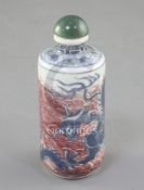 A Chinese underglaze blue and copper red 'dragon' cylindrical snuff bottle, 19th century, the