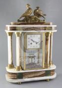 A 1930's polychrome onyx portico mantel clock, surmounted by ormolu doves, the 3.5 inch Arabic