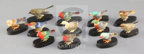 A set of twelve Japanese coloured ivory figures of birds, early 20th century, each with mother of