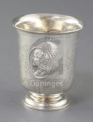 A Victorian silver cup by George Angell & Co, with engraved decoration and two repousse oval