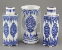 A pair of Chinese blue and white hexagonal jars and covers and a similar beaker vase, Kangxi period,