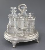 A George III silver oval cruet stand by Burwash & Sibley, with reeded handle and shell motifs,