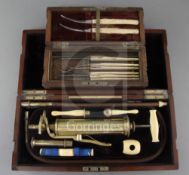 An Evans & Wormull ivory and brass medical pump, in original fitted case, 13in., and a cased set