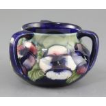 A Moorcroft pansy pattern three handle vase, second quarter 20th century, on a pale green to