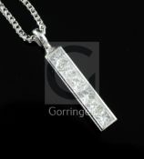 A modern Theo Fennell 18ct white gold and six stone princess cut diamond set Strip pendant, on a