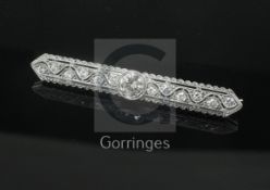 An early 20th century style 18ct white gold and diamond set bar brooch, the pierced millegrain